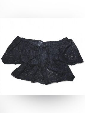 Black lace off-the-shoulder crop-top with ruffle trim.